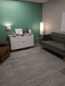 Office space with couch and lamps